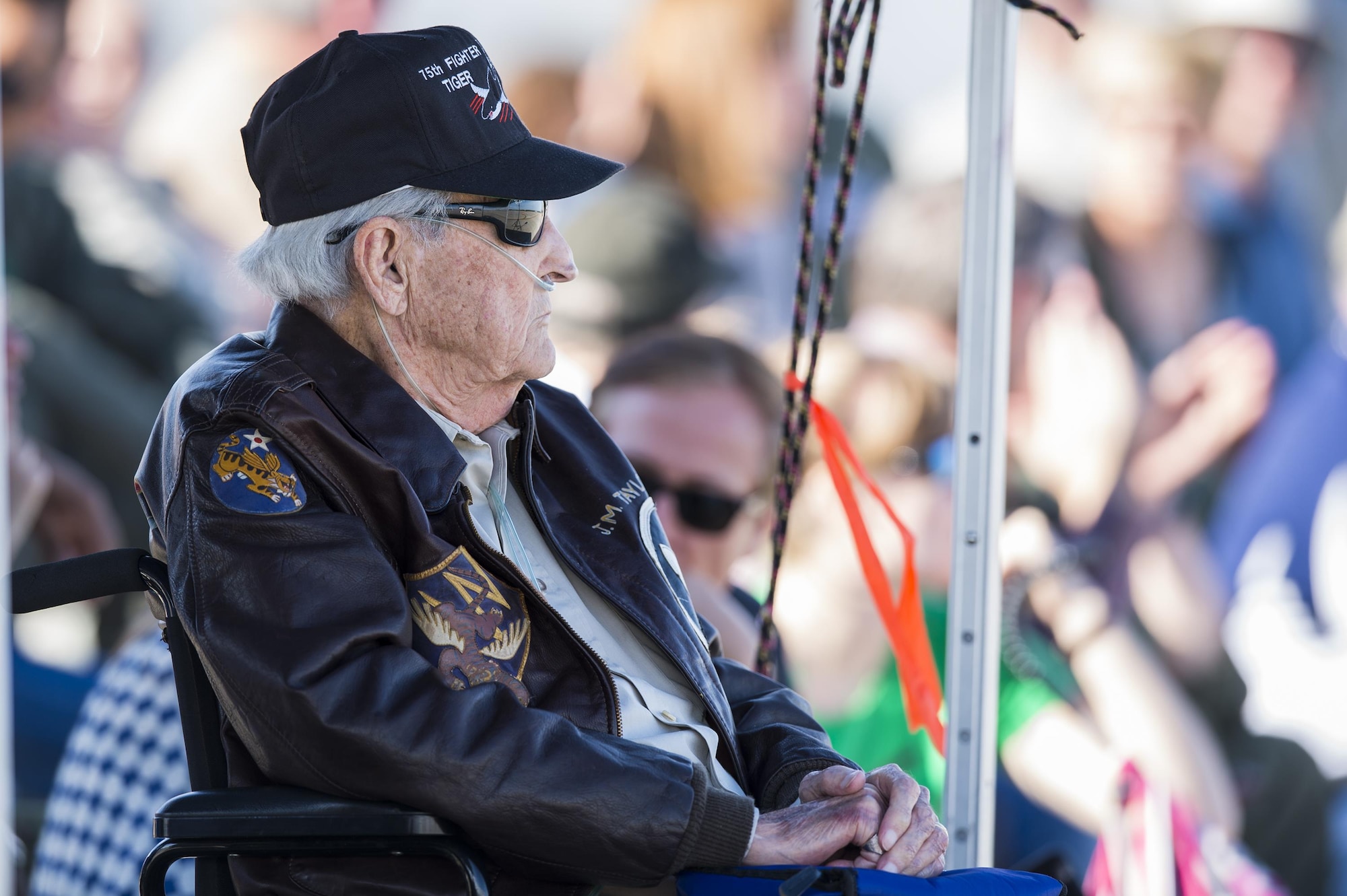 J.M. Taylor, World War II veteran and prisoner of war, watches a combat search and rescue demonstration during the 75th Anniversary Flying Tiger Reunion, March 10, 2017, at Moody Air Force Base, Ga. In 1941, President Roosevelt signed an executive order forming the American Volunteer Group. The AVG was organized into the 1st, 2nd, and 3rd Pursuit Squadrons and later disbanded and replaced by the 23d Fighter Group in 1942. Under the command of Gen. Claire Chennault, the Flying Tigers comprised of the 74th, 75th, and 76th Pursuit Squadrons defended China against the Japanese. Throughout World War II, the Flying Tigers achieved combat success and flew the US-made Curtiss P-40 Warhawks painted with the shark-mouth design. (U.S. Air Force photo by Senior Airman Ceaira Young)