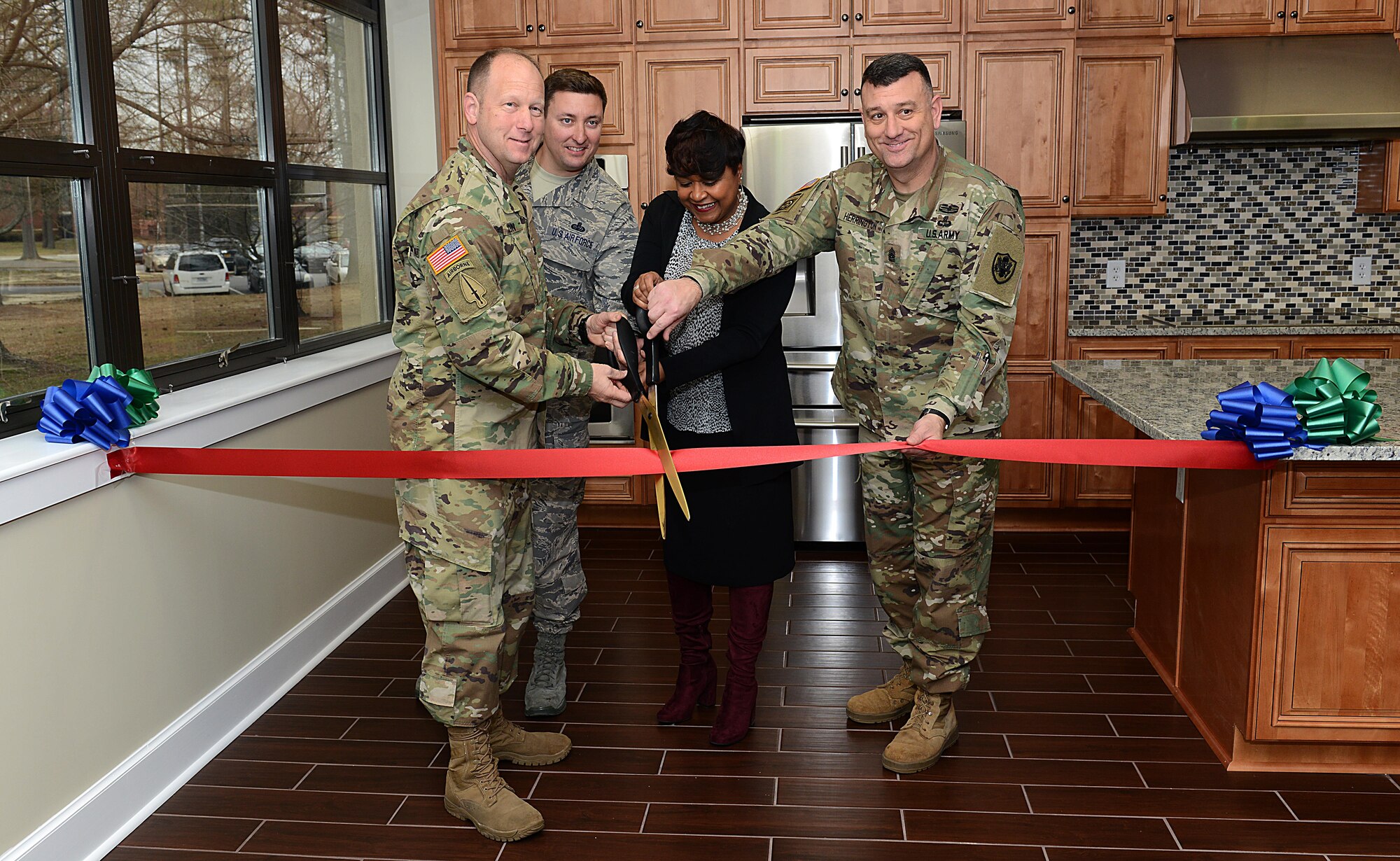 Leadership assigned to the 733rd Mission Support Group and 633rd Force Support Squadron Military and Family Readiness Flight cut the ceremonial ribbon during the Army Community Service Emergency Family Assistance Center’s teaching kitchen opening ceremony at Joint Base Langley-Eustis, Va., March 13, 2017. The new kitchen features a flat-top range, oven, refrigerator, dishwasher and ice maker, and will be used to teach cooking classes and will also be used to provide meals in the event of a crisis. (U.S. Air Force photo/Staff Sgt. Teresa J. Cleveland)