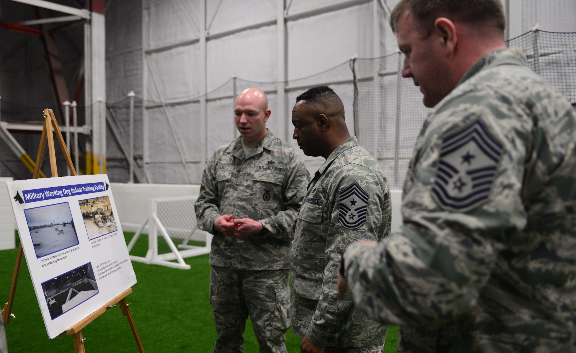 Technical Sgt. Matthew Lee, kennel master assigned to the 28th Security Forces Squadron, talks about the specifics of the indoor military working dog facility to Chief Master Sgt. Calvin Williams, Air Force Global Strike Command command chief, and Chief Master Sgt. Adam Vizi, 28th Bomb Wing command chief, during a visit to Ellsworth Air Force Base, S.D., March 2, 2017. The indoor facility is unique to Ellsworth as the only one of its kind in AFGSC. (U.S. Air Force photo by Airman 1st Class Denise M. Jenson)