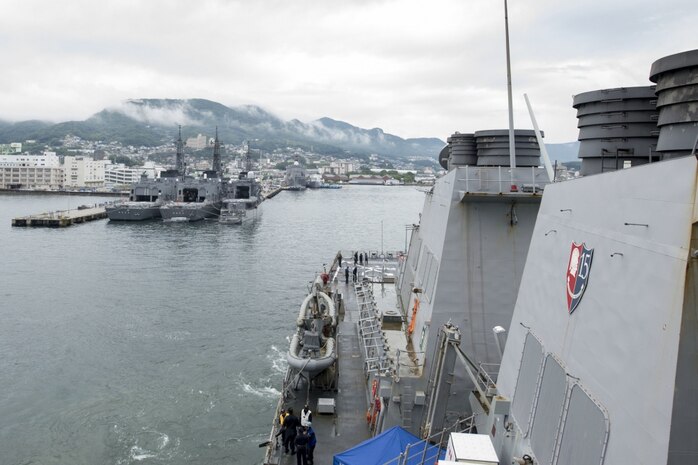 File photo on the Arleigh Burke-class guided-missile destroyer USS Curtis Wilbur (DDG 54) pulls into Sasebo, Japan for a scheduled port visit. Curtis Wilbur is on patrol with Carrier Strike Group Five (CSG 5) supporting security and stability in the Indo-Asia-Pacific region. 