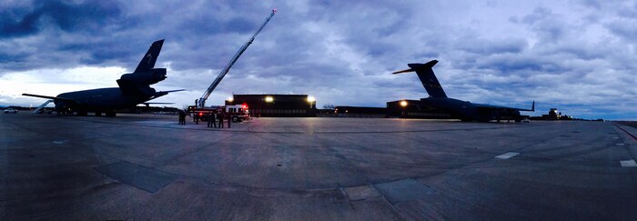 During an Off-Station trainer visit to the U.S. Air Force Academy, Aircrews from the 2nd Air Refueling Squadron and 14th Airlift Squadron work with the local fire department preparing their KC-10 (left) and C-17(right) aircraft for inclement weather at Peterson Air Force Base, Colorado, Feb. 11, 2017.