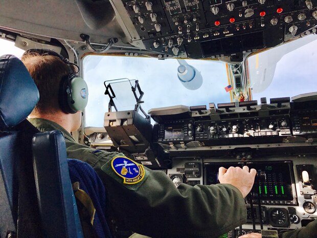 1st Lt. Alexander Sakovich, 14th Airlift Squadron pilot, from Joint Base Charleston, South Carolina, successfully conducts his first air refueling contact with a KC-10 Extender flown by the 2nd Air Refueling Squadron from Joint Base McGuire-Dix Lakehurst, New Jersey. The aircraft were flying at 26,000 feet above the Midwest of the U.S. on Feb. 9, 2017.