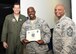 Air Force Col. Michael Hernandez, 325th Fighter Wing commander and Chief Master Sgt. Craig Williams, 325th FW command chief, pose for a photo with Senior Master Sgt. Max Walker, 43d Aircraft Maintenance Unit assistant superintendent at the 43d AMU on Tyndall AFB, Fla., Feb. 7, 2017. Walker is one of 531 senior master sergeants selected for the rank of chief master sergeant from a total of 2,229. (U.S. Air Force photo by Senior Airman Solomon Cook/Released)