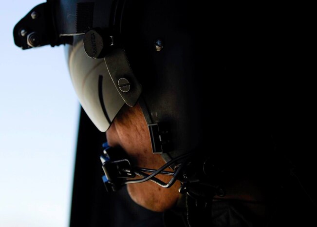 A Singapore air force crew chief looks out the window of a CH-47 Chinook during a Red Flag 17-2 combat search and rescue mission over the Nevada Test and Training Range, March 6, 2017. For 20 years in Grand Prairie, Texas, the Singapore air force has worked in unison with its pilots, air crews and the United States Army. (U.S. Air Force photo by Airman 1st Class Kevin Tanenbaum/Released) 