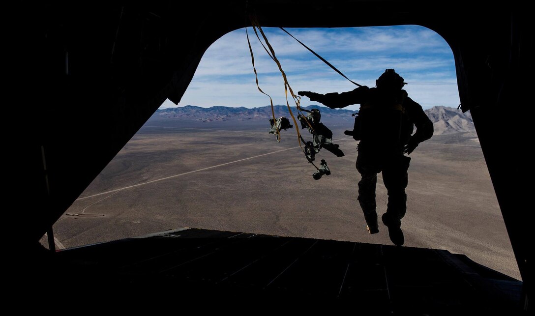 A Survival, Evasion, Resistance, and Escape specialist performs a static line jump out of a CH-47 Chinook during a Red Flag 17-2 mission over the Nevada Test and Training Range, March 7, 2017. Red Flag provides vital training and real world scenarios that progress Singapore Air Force air crews to the next level in their skills. (U.S. Air Force photo by Airman 1st Class Kevin Tanenbaum/Released)