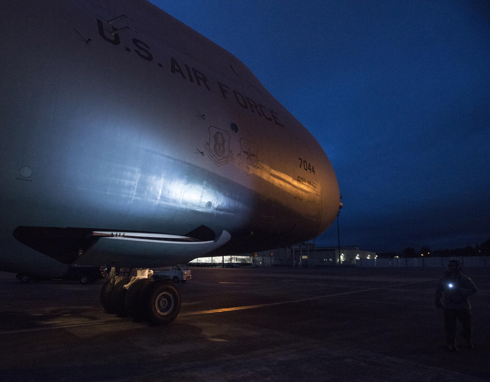 Staff Sgt. Piere Manivong, 22nd AS, completes a pre-flight inspection of a C-5M Super Galaxy prior to a flight March 7, 2017 from Yokota Air Base, Japan, to Osan Air Base, South Korea. As a flight engineer, Manivong is responsible for completing pre-flight inspections of the aircraft prior to the pilots coming on board to ensure everything is safe for the flight.  (U.S. Air Force photo/Staff Sgt. Nicole Leidholm)