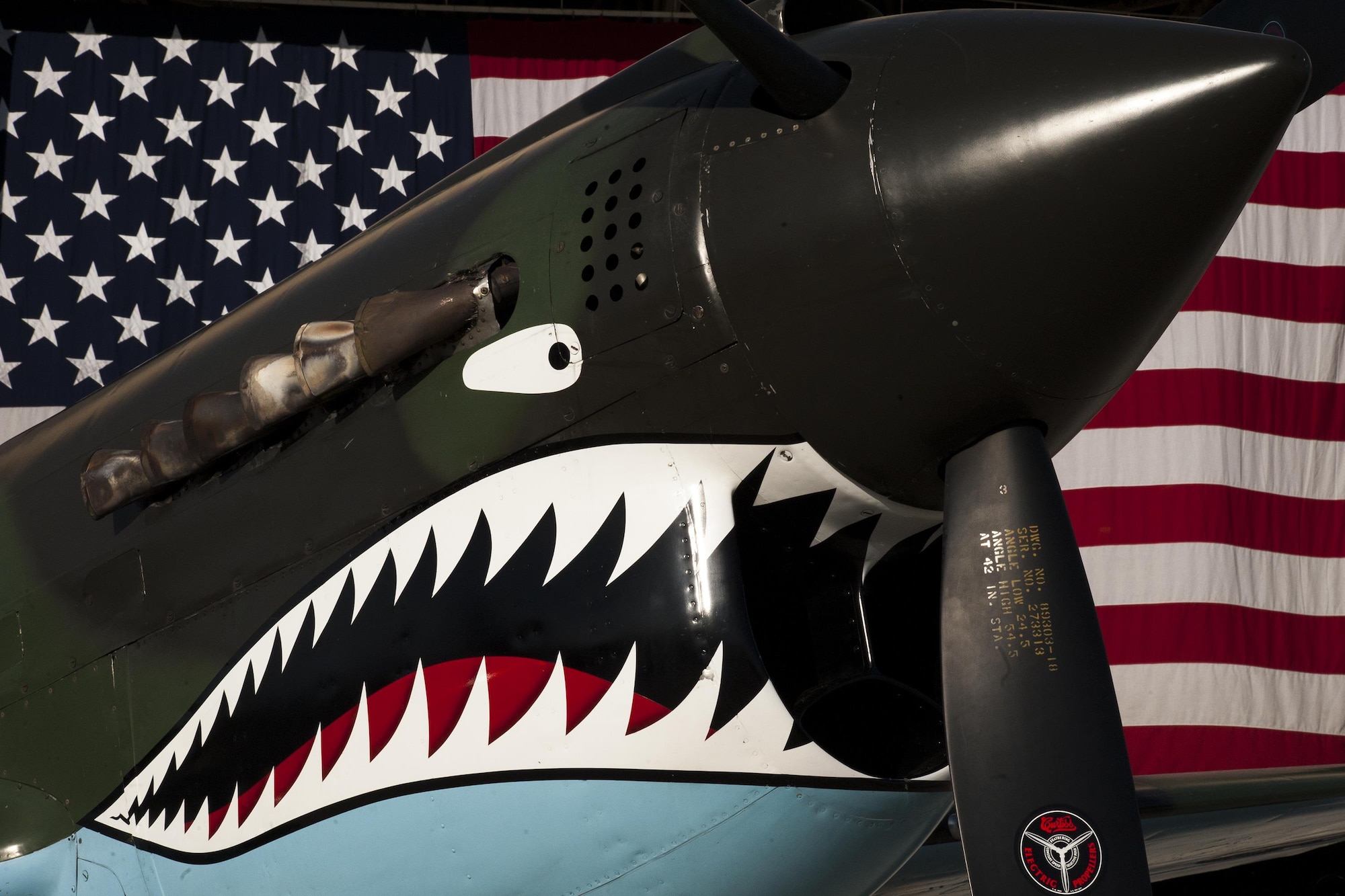 A Curtiss P-40 Warhawk static display rests on the flight line during the 75th Anniversary Flying Tiger Reunion, March 10, 2017, at Moody Air Force Base, Ga. In 1941, President Roosevelt signed an executive order forming the American Volunteer Group. The AVG was organized into the 1st, 2nd, and 3rd Pursuit Squadrons and later disbanded and replaced by the 23d Fighter Group in 1942. Under the command of Gen. Claire Chennault, the Flying Tigers comprised of the 74th, 75th, and 76th Pursuit Squadrons defended China against the Japanese. Throughout World War II, the Flying Tigers achieved combat success and flew the US-made Curtiss P-40 Warhawks painted with the shark-mouth design. (U.S. Air Force photo by Andrea Jenkins)