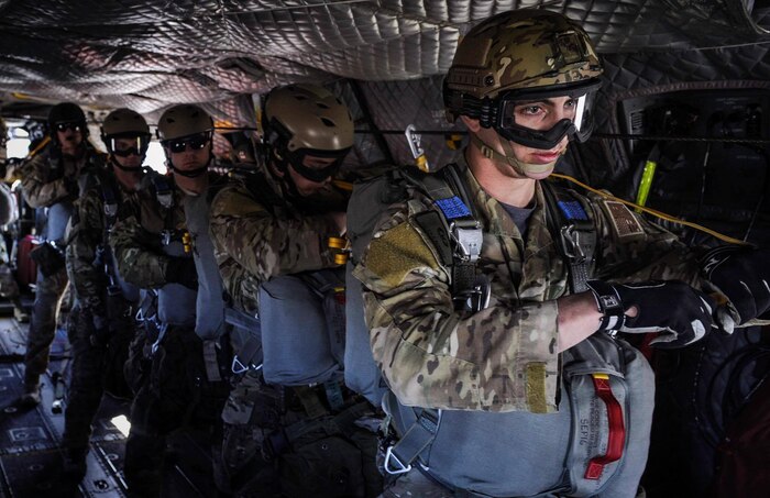 Survival, Evasion, Resistance, and Escape specialists wait to jump out of a CH-47 Chinook over the Nevada Test and Training Range, during Red Flag 17-2, March 7, 2017. Red Flag provides combat training in a degraded and operationally limited environment making the training missions as realistic as possible. (U.S. Air Force photo by Airman 1st Class Kevin Tanenbaum/Released)
