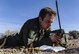 A simulated injured pilot calls for rescue on the Nevada Test and Training Range, during a Red Flag 17-2 combat search and rescue mission, March 8, 2017. CSAR is a search and rescue operation that is carried out within or near combat zones. (U.S. Air Force photo by Airman 1st Class Kevin Tanenbaum/Released)