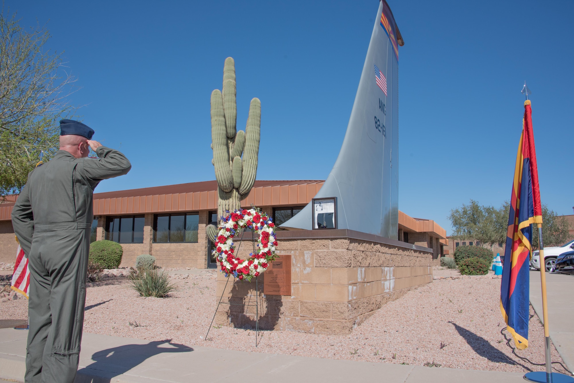 Col. Edwin Slocum, vice wing commander of the 161st Air Refueling Wing, salutes after placing a wreath during the 35th Annual Copper 5 Memorial at the Goldwater Air National Guard Base, Mar. 13. Copper 5 was the call sign for a Boeing KC-135A Stratotanker aerial refueling jet from the 161st that was involved in a mid-air collision with a civilian plane, killing the four person aircrew on Mar. 13, 1982.