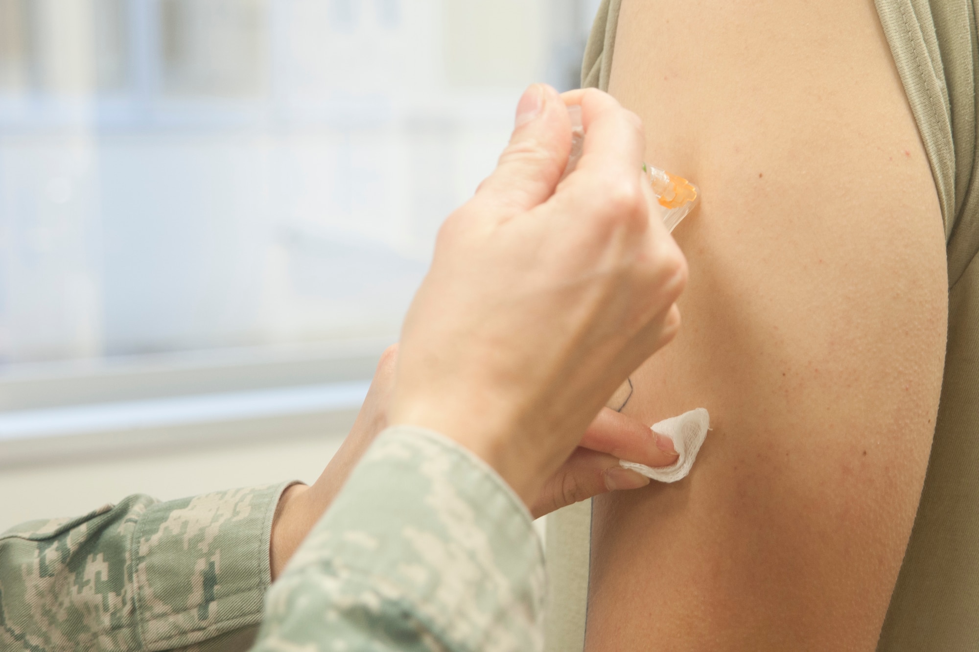 An Airman receives a vaccine March 14, 2017, at Kadena Air Base, Japan. Medical readiness is one thing held high on the priority list for members preparing to deploy. Ensuring your shot records are current year-round can save time, and a few extra pinches, when the tasking comes in. (U.S. Air Force photo by Airman 1st Class Quay Drawdy)