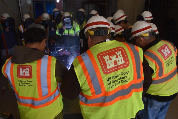 Class participants watch as a welding instructor performs a demonstration during the United States Army Corps of Engineers Far East District quality verification course March 13-17, 2017. The course teaches the participant how to interpret the various methods and techniques employed in weldments and assuring the quality of welds. 