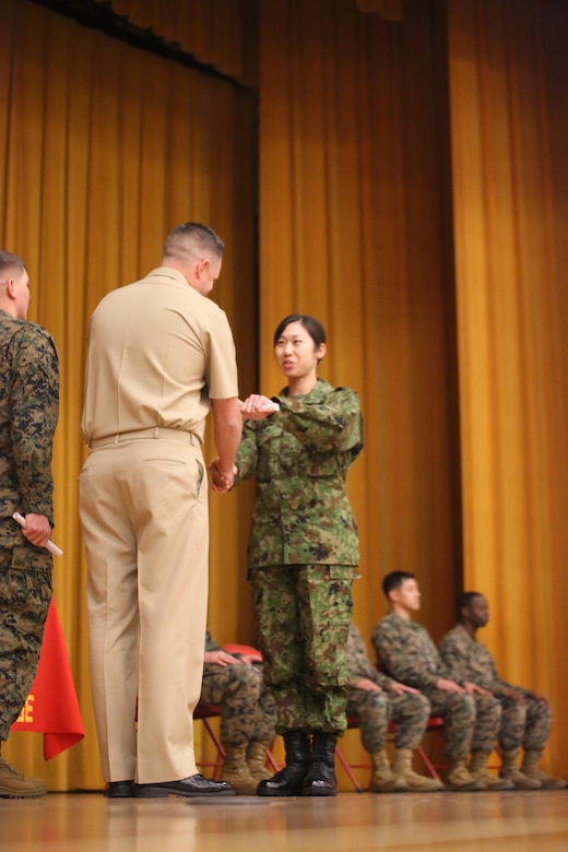 Japan Ground Self-Defense Force Sgt. Mizuho Ban receives her graduation certificate for completing Corporal’s Course Feb. 10 aboard Camp Foster, Okinawa, Japan. Ban has been in the JGSDF for eight years. Ban travelled over 700 miles from Chitose City, Hokkaido, Japan, to attend the course. Ban is a radio communicator with 1st Electronic Warfare Unit, 2nd Direction Finding Company.