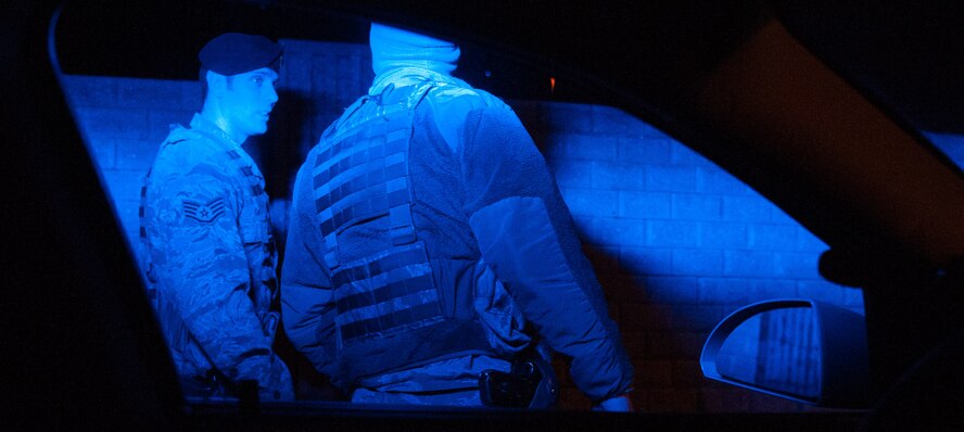 Staff Sgt. Nigel Carl, 86th Security Forces Squadron ravel patrolman, instructs Senior Airman Tyler Obson, 86th SFS member, after he pulls someone over on Ramstein Air Base, Germany, Mar. 7, 2017. New to patrol, Obson had Carl tag along with him so that he can be assisted learning his new job. (U.S. Air Force photo by Senior Airman Lane T. Plummer)