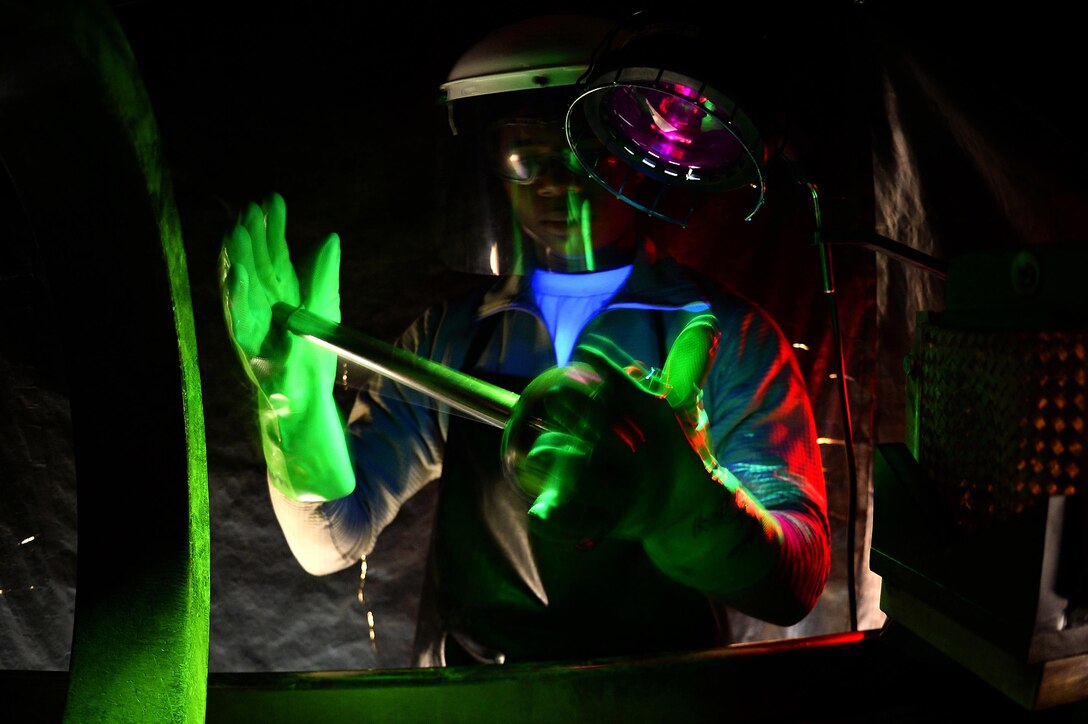 A 48th Equipment Maintenance Squadron nondestructive inspection journeyman inspects an aircraft component on Royal Air Force Lakenheath, England, March 10, 2017. NDI Airmen are tasked with ensuring aircraft and weapons systems parts are structurally safe with no damage, flaws or stress fractures. (U.S. Air Force photo/Staff Sgt. Emerson Nuñez)