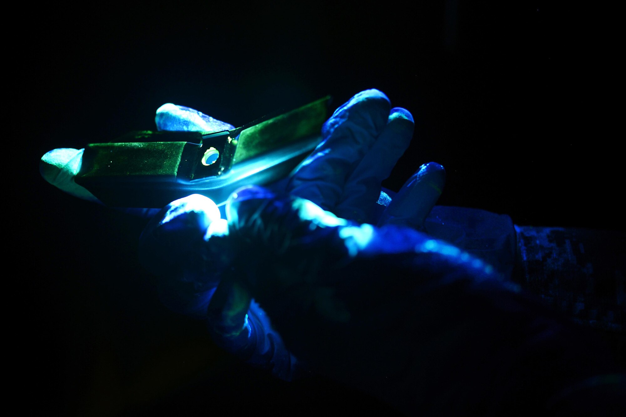 A 48th Equipment Maintenance Squadron nondestructive inspection journeyman examines an aircraft component for cracks on Royal Air Force Lakenheath, England, March 10, 2017. Nondestructive inspection technicians perform five different types of inspections – x-ray, ultrasonic, eddy current, magnetic particle and penetrant – to detect abnormalities. (U.S. Air Force photo/Staff Sgt. Emerson Nuñez)