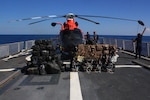 U.S. Coast Guard Cutter Spencer crew members secure the helicopter to the flight deck of the ship Saturday, Feb. 18, 2017. The Spencer returned from a 74-day Eastern Pacific ocean patrol after seizing $92 million in cocaine.(U.S. Coast Guard photo by Petty Officer 2nd Class Timothy Midas)