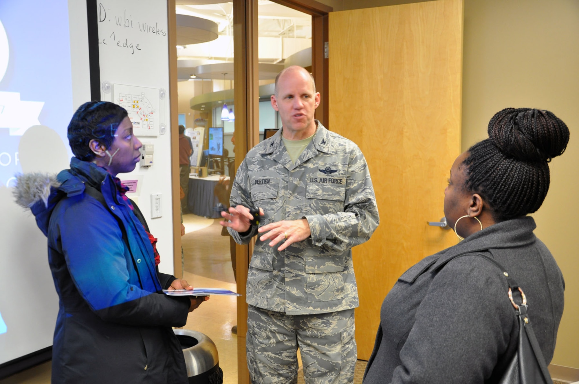 Col. Evan Dertien, vice commander of AFRL, answers questions from audience members after delivering a presentation called “AFRL 101”, a 10-minute overview of the mission and capabilities of the Air Force Research Laboratory, a global leader in warfighter capabilities. (U.S. Air Force photo/Bryan Ripple)