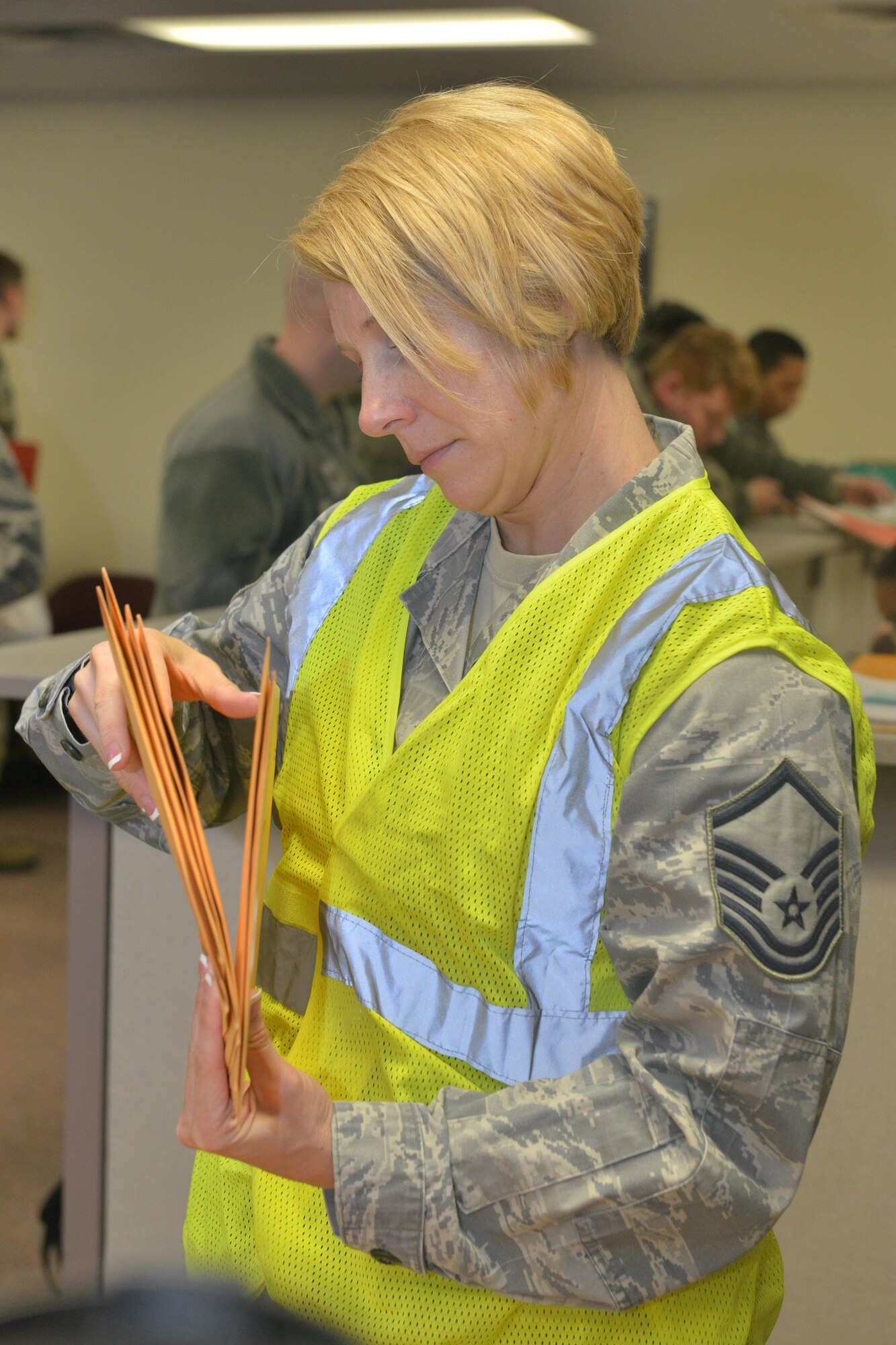 Master Sgt. Miranda Minshew, 5th Medical Operations Squadron public health flight chief, sorts through medical documents at Minot Air Force Base, N.D., March 9, 2017. The 23rd Bomb Squadron sent a number of B-52H Stratofortresses to take over day-to-day operations. (U.S. Air Force photo/Airman 1st Class Jessica Weissman)