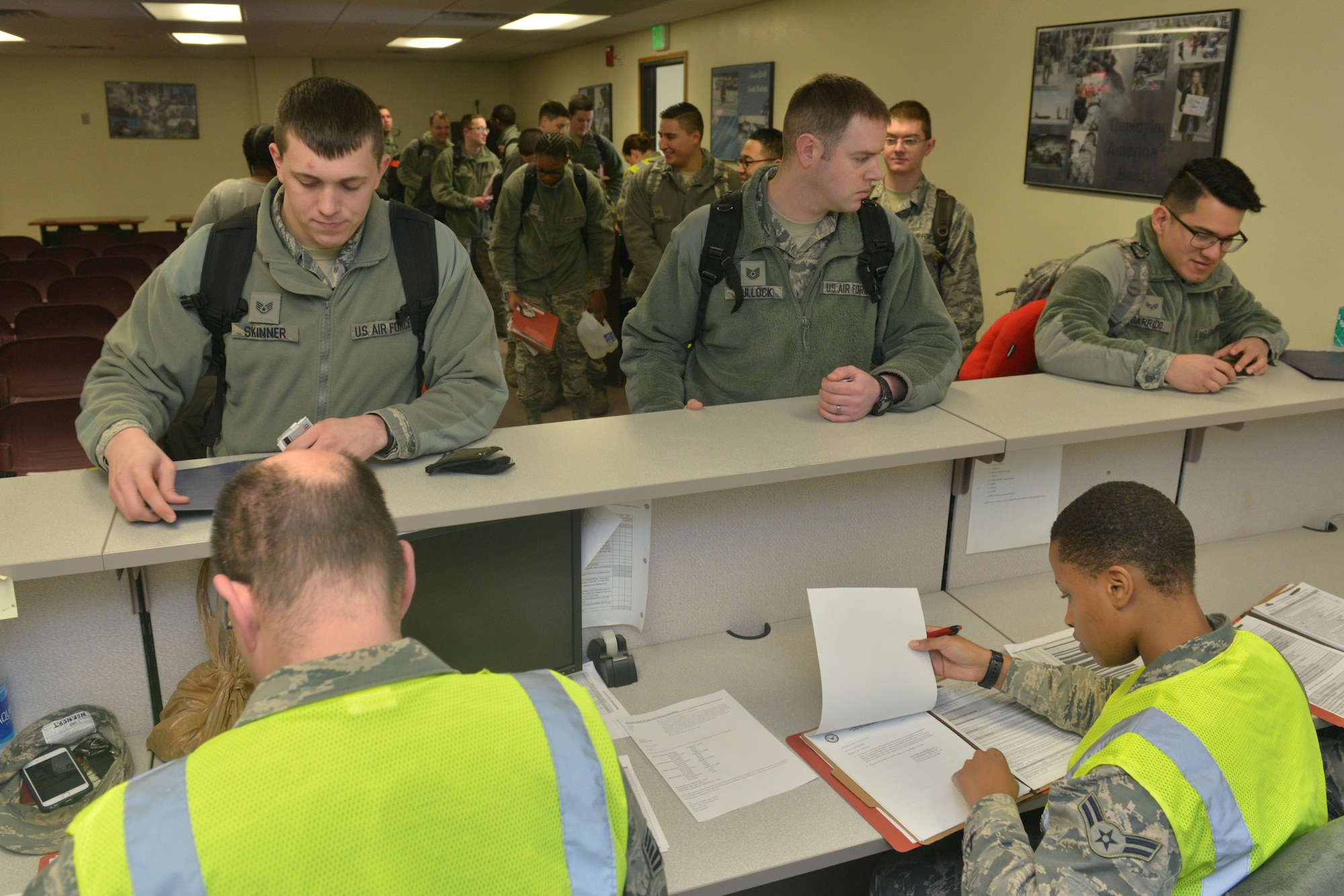 Airmen from the 5th Maintenance Squadron and 5th Aircraft Maintenance Squadron go through a deployment processing line at Minot Air Force Base, N.D., March 9, 2017. The 23rd Bomb Squadron sent a number of B-52H Stratofortresses to take over day-to-day operations. (U.S. Air Force photo/Airman 1st Class Jessica Weissman)