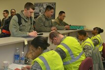 Airmen from the 5th Maintenance Squadron and 5th Aircraft Maintenance Squadron go through a deployment processing line at Minot Air Force Base, N.D., March 9, 2017. This will mark the first time in 12 years aircraft from the base have deployed in support of combat operations. (U.S. Air Force photo/Airman 1st Class Jessica Weissman)