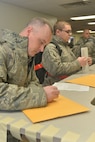 Airmen from the 5th Maintenance Squadron and 5th Aircraft Maintenance Squadron go through a deployment processing line at Minot Air Force Base, N.D., March 9, 2017. This will mark the first time in 12 years that aircraft from the base have deployed in support of combat operations. (U.S. Air Force photo/Airman 1st Class Jessica Weissman)