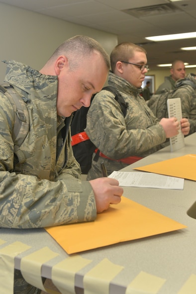 Airmen from the 5th Maintenance Squadron and 5th Aircraft Maintenance Squadron go through a deployment processing line at Minot Air Force Base, N.D., March 9, 2017. This will mark the first time in 12 years that aircraft from the base have deployed in support of combat operations. (U.S. Air Force photo/Airman 1st Class Jessica Weissman)