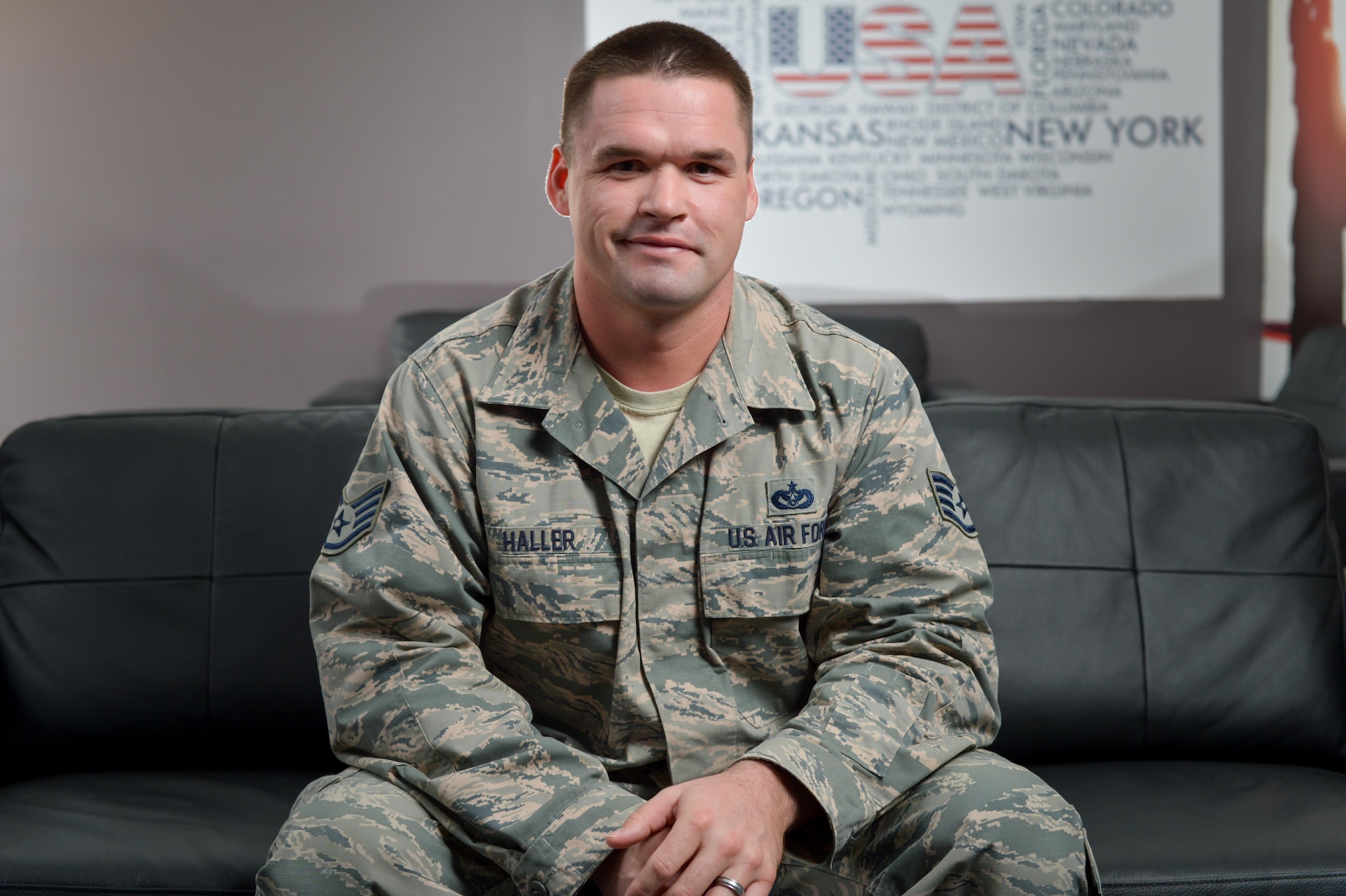 Staff Sgt. Jordan, 380th Expeditionary Civil Engineer Squadron engineer, poses for a photograph in a facility he remodeled at an undisclosed location in Southwest Asia, March 14, 2017. Jordan volunteered more than 250 hours to complete the project which is now the new 380th Air Expeditionary Wing Airman Ministry Center. The facility is projected to be used more than 72,000 times annually. (U.S. Air Force photo/Senior Airman Tyler Woodward)
