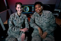 Second Lts. Ranell Cavitt and Maggie Jones, 3rd Space Experimentation Squadron, have been nearly inseparable since they arrived at Schriever Air Force Base, Sept. 30, 2015. They have only been separated professionally for a short time, during training, since their arrival and work closely together as Automated Navigation and Guidance Experiment in Local Space satellite mission planners and trainers. Their shared experience and passion for space and science helped build a friendship and camaraderie that appears like a life-long bond, though the pair met less than two years ago. (U.S. Air Force photo/Christopher DeWitt)