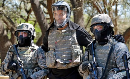 Kyle Anderson of the San Antonio Spurs poses with security forces personnel training at Joint Base San Antonio-Camp Bullis March 14. 