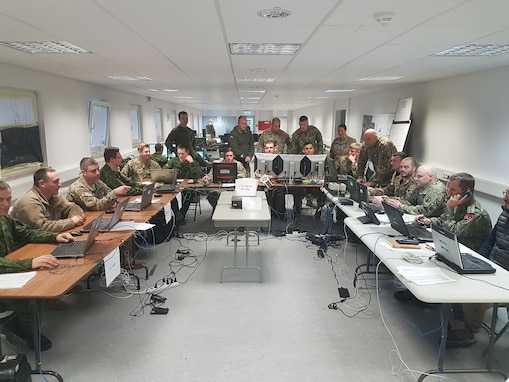 Soldiers of the 2500th and 250th Digital Liaison Detachments work with NATO allies March 10 during the multinational exercise Dynamic Front II in their Tactical Operations Center at Grafenwoehr, Germany. (Photo courtesy 2500th Digital Liaison Detachment)