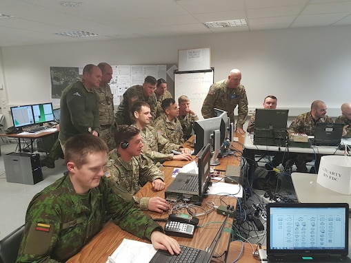 Soldiers of the 2500th and 250th Digital Liaison Detachments work with NATO allies March 10 during the multinational exercise Dynamic Front II in their Tactical Operations Center at Grafenwoehr, Germany. (Photo courtesy 2500th Digital Liaison Detachment)