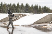 A U.S. Army Reserve Soldier carries the MK-19 automatic grenade launcher for qualification setup during Operation Cold Steel at Fort McCoy, Wis., March 13, 2017. Operation Cold Steel is the U.S. Army Reserve's crew-served weapons qualification and validation exercise to ensure that America's Army Reserve units and soldiers are trained and ready to deploy on short-notice and bring combat-ready and lethal firepower in support of the Army and our joint partners anywhere in the world. 