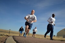 Airmen demonstrate their enthusiasm during the annual St. Paddy’s Day run at Schriever Air Force Base Colorado, Wednesday, March 8 , 2017. Windy conditions couldn’t damper Schriever Airmen’s spirit as more than 200 people participated in the run. (U.S. Air Force photo/Dennis Rogers)