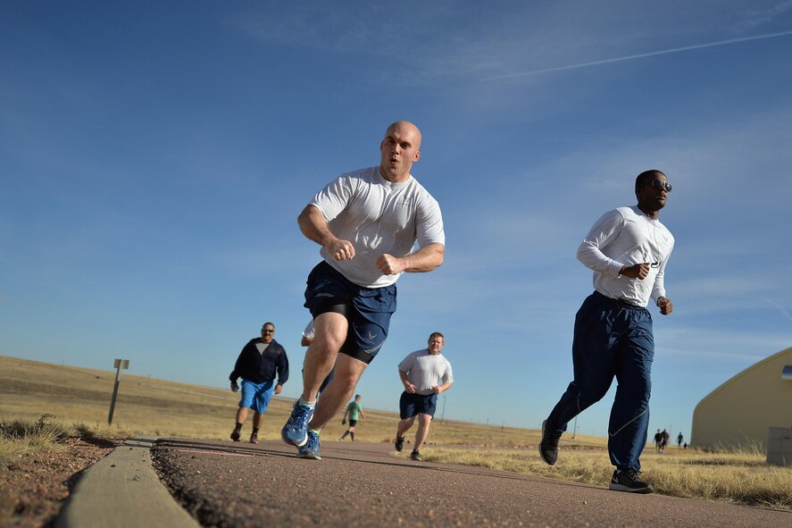 Airmen demonstrate their enthusiasm during the annual St. Paddy’s Day run at Schriever Air Force Base Colorado, Wednesday, March 8 , 2017. Windy conditions couldn’t damper Schriever Airmen’s spirit as more than 200 people participated in the run. (U.S. Air Force photo/Dennis Rogers)