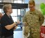 U.S. Army 1st Sgt. Melissa White, Foxtrot Company,  222nd Aviation Regiment, 128th Aviation Brigade first sergeant and Fort Eustis Diamond Council president, presents a $10 gift card for the Exchange Food Court to U.S. Army Specialist Johna Russell, 690th Rapid Port Opening Element forklift operator at Joint Base Langley-Eustis, Va., March 9, 2017. The Diamond Council performed the random act of kindness to show their appreciation to junior enlisted service members. (U.S. Air Force photo/Staff Sgt. Teresa J. Cleveland)
