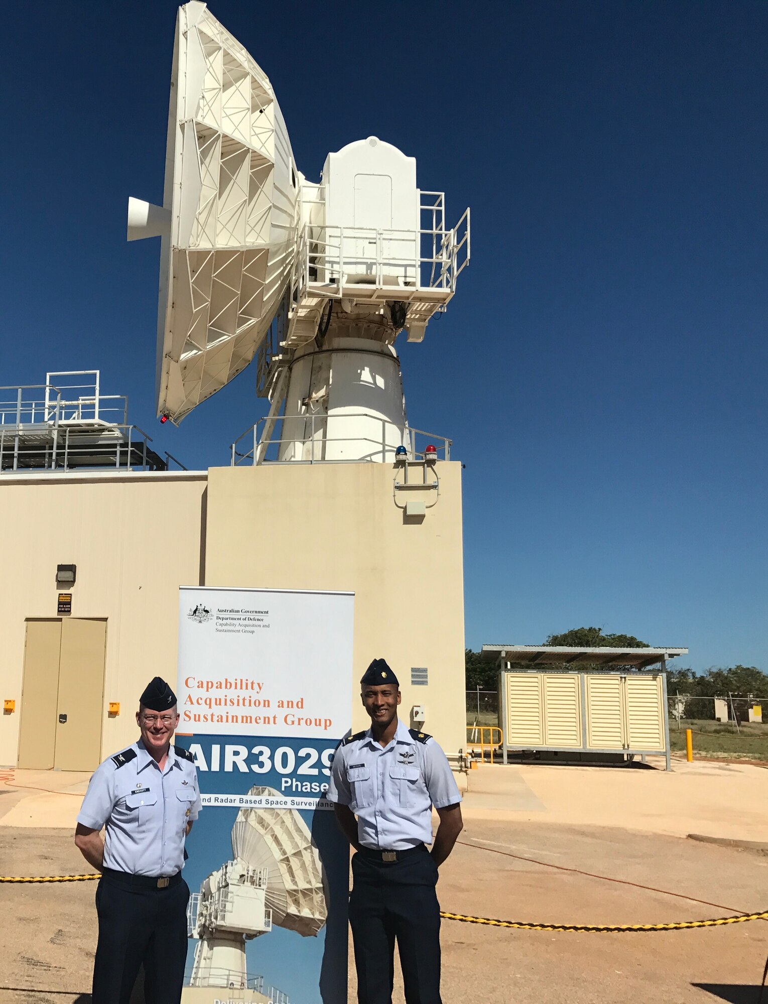 NAVAL COMMUNICATIONS STATION HOWARD E. HOLT, Western Australia  -- Col. Troy Endicott, 21st Operations Group commander, left, and Maj. Alfred Maynard, 21st OG Air Force liaison officer, attend a ribbon cutting to commemorate the C-Band Space Surveillance Radar System’s attainment of full operational status at Naval Communications Station Harold E. Holt, Western Australia, March 7, 2017. The radar was dissembled, transported and rebuilt in Australia following the deactivation of Antigua Air Station, Antigua, in July 2015, where it was originally located. (Courtesy Photo)
