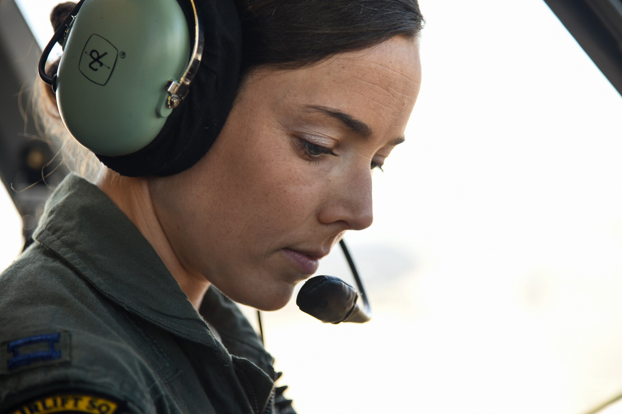 Capt. Jamie LaRivee, 21st Airlift Squadron C-17 Globemaster III pilot, simulates aircraft procedures at Travis Air Force Base, Calif., March 14, 2017. LaRivee's mother was in the first class of female cadets at the Air Force Academy. (U.S. Air Force photo by Senior Airman Sam Salopek)