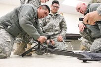 U.S. Army Reserve Soldiers practice assembling the mount for the M240B machine gun while conducting preliminary marksmanship instruction during Operation Cold Steel at Fort McCoy, Wis., March 12, 2017. Operation Cold Steel is the U.S. Army Reserve's crew-served weapons qualification and validation exercise to ensure that America's Army Reserve units and soldiers are trained and ready to deploy on short-notice and bring combat-ready and lethal firepower in support of the Army and our joint partners anywhere in the world. (U.S. Army Reserve photo by Staff Sgt. Debralee Best, 84th Training Command)