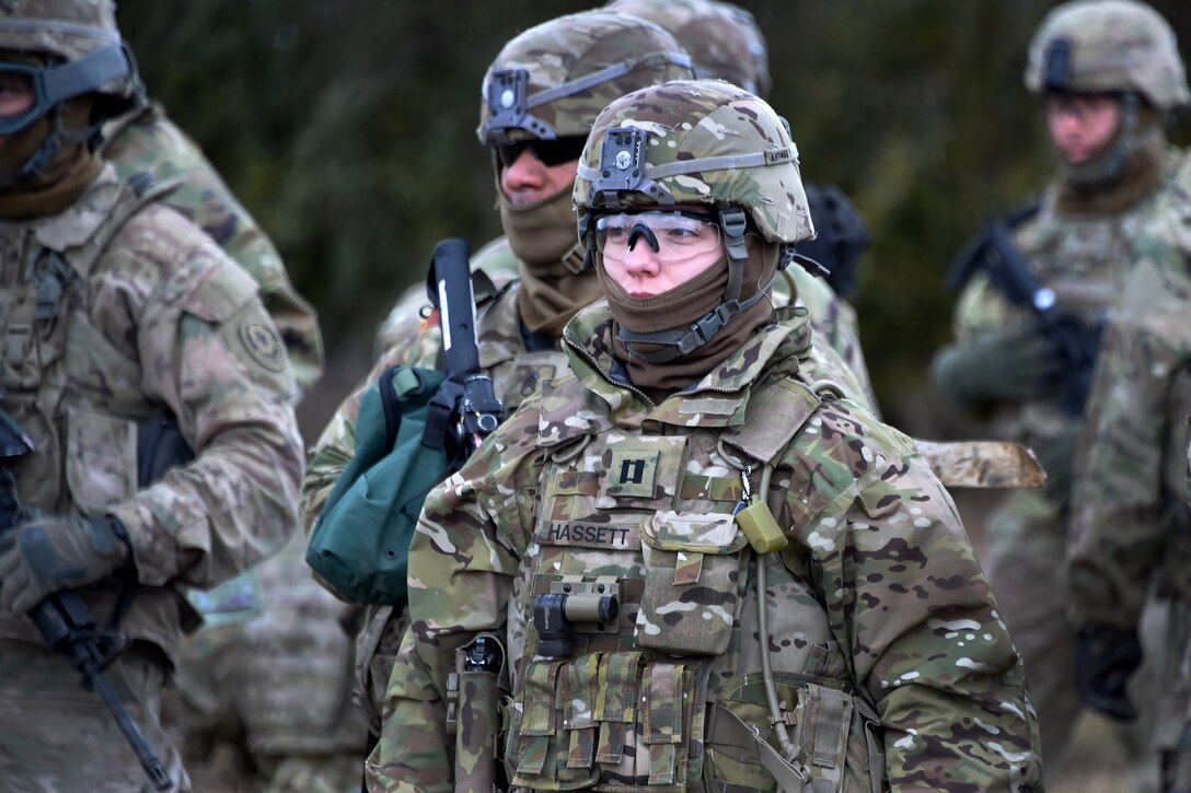Army Cpt. Amanda Hassett, foreground, waits with her soldiers during slingload operations at part of exercise Dynamic Front II at the 7th Army Training Command's Grafenwoehr Training Area, Germany, March 9, 2017. Hassett is assigned to Field Artillery Squadron, 2nd Cavalry Regiment. Army photo by Gertrud Zach