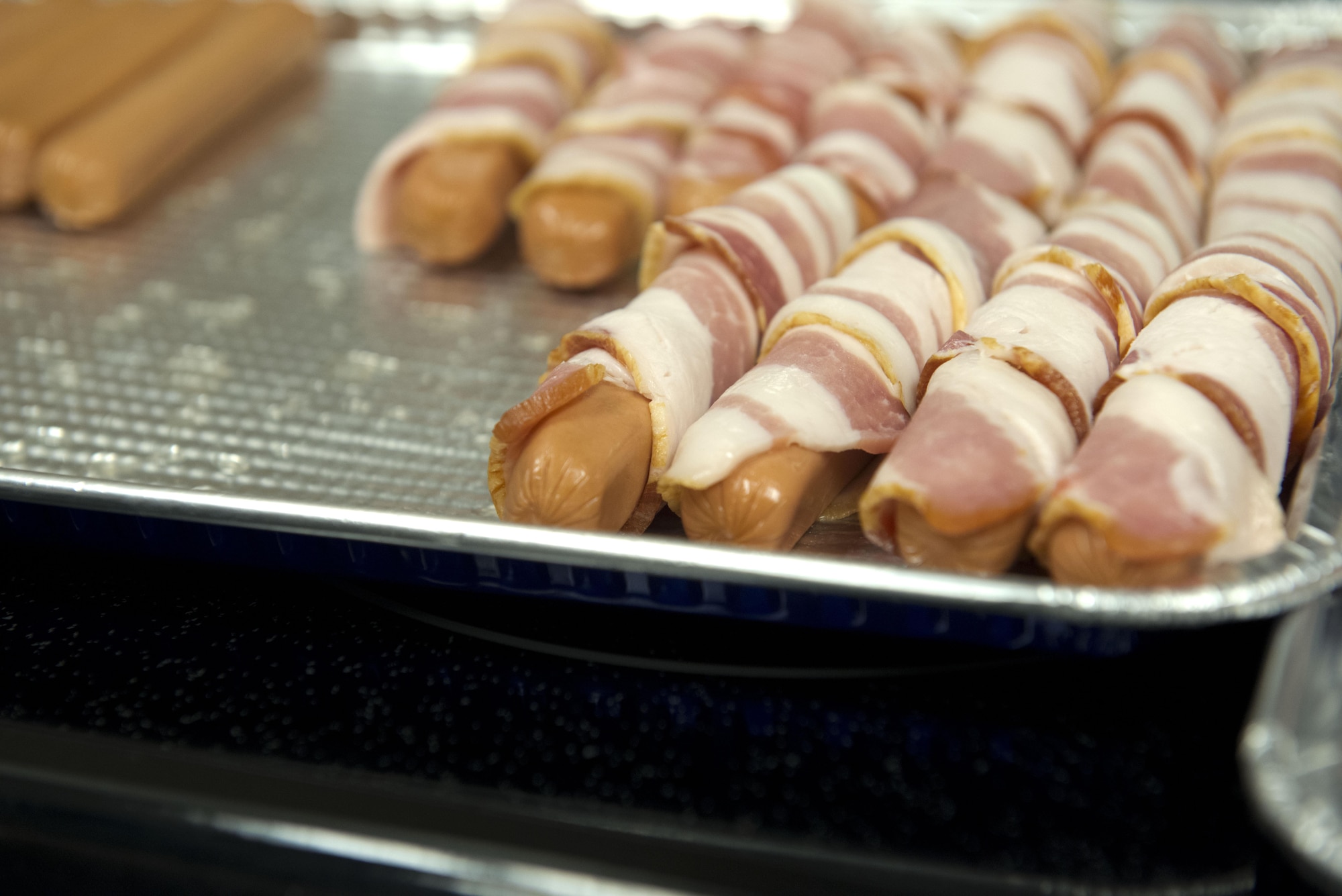 The Air Force Sergeant’s Association held a mentorship session at the United Services Organization on Joint Base Elmendorf-Richardson, Alaska March 10. The AFSA members showed up early to make bacon-wrapped hotdogs for the event. 