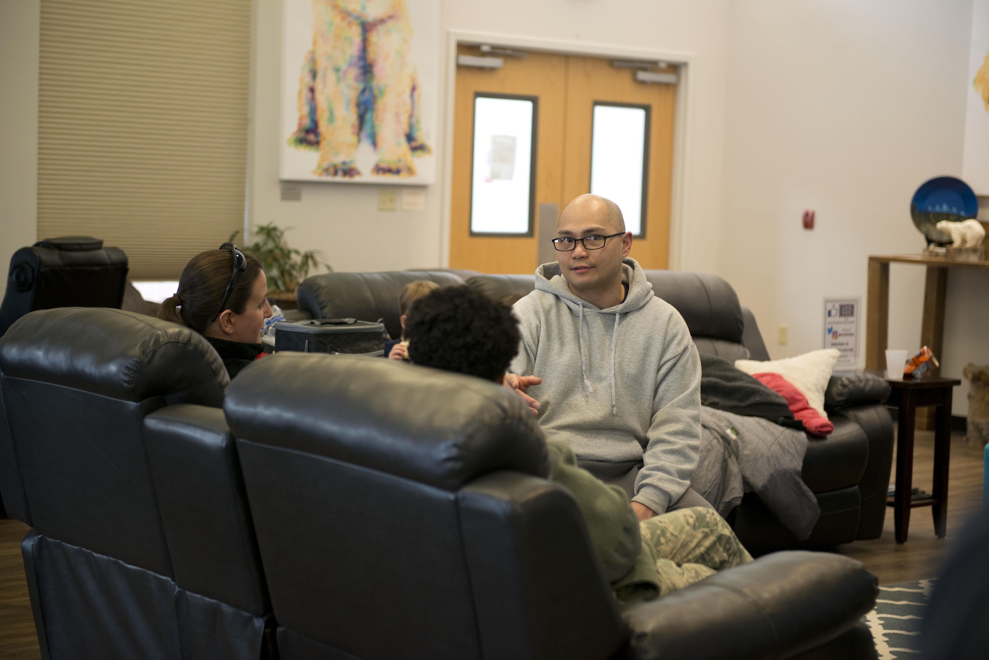 Technical Sgt. Glen Giron, 703d Aircraft Maintenance Squadron, noncommissioned officer in charge of Commander’s Support Staff sits and chats with some Airmen at the United Services Organization on Joint Base Elmendorf-Richardson, Alaska, March 10. Giron is a member of the Air Force Sergeant’s Association and was helping out at a mentorship event where members reached out to and answered questions from Airmen in an environment not constrained by time or rank. 