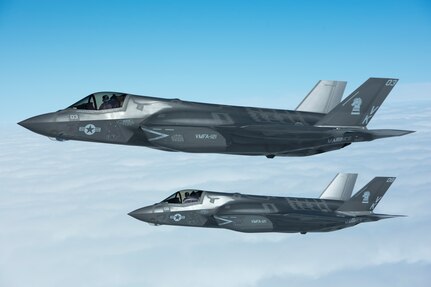 U.S. Marine Corps F-35B Lightning IIs from Marine Fighter Attack Squadron 121 fly in formation next to a U.S. Air Force KC-135 Stratotanker from the 909th Air Refueling Squadron March 14, 2017, over Pacific waters. The F-35B is a fifth-generation fighter, which is the world’s first operational supersonic short takeoff and vertical landing aircraft.