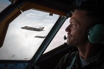 U.S. Air Force Capt. Matt Davis, 909th Air Refueling Squadron KC-135 Stratotanker pilot, flies in formation with U.S. Marine Corps F-35B Lightning IIs from Marine Fighter Attack Squadron 121, March 14, 2017, over the Pacific Ocean. The training sortie marked the first air refueling mission with F-35s in the 909th ARS’s area of operation. 