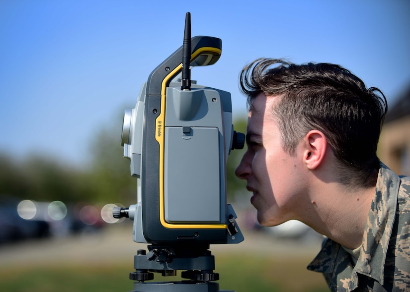 U.S. Air Force Airman 1st Class Ryan Mundt, 633rd Civil Engineer Squadron engineering technician, performs an optical site survey, at Joint Base Langley-Eustis, Va., March 9, 2017. Mundt is a member of the mapping section, which has more than 45,000 drawings that are kept and maintained, to include all on-base facilities and floor plans. (U.S. Air Force photo/Senior Airman Areca T. Bell)

