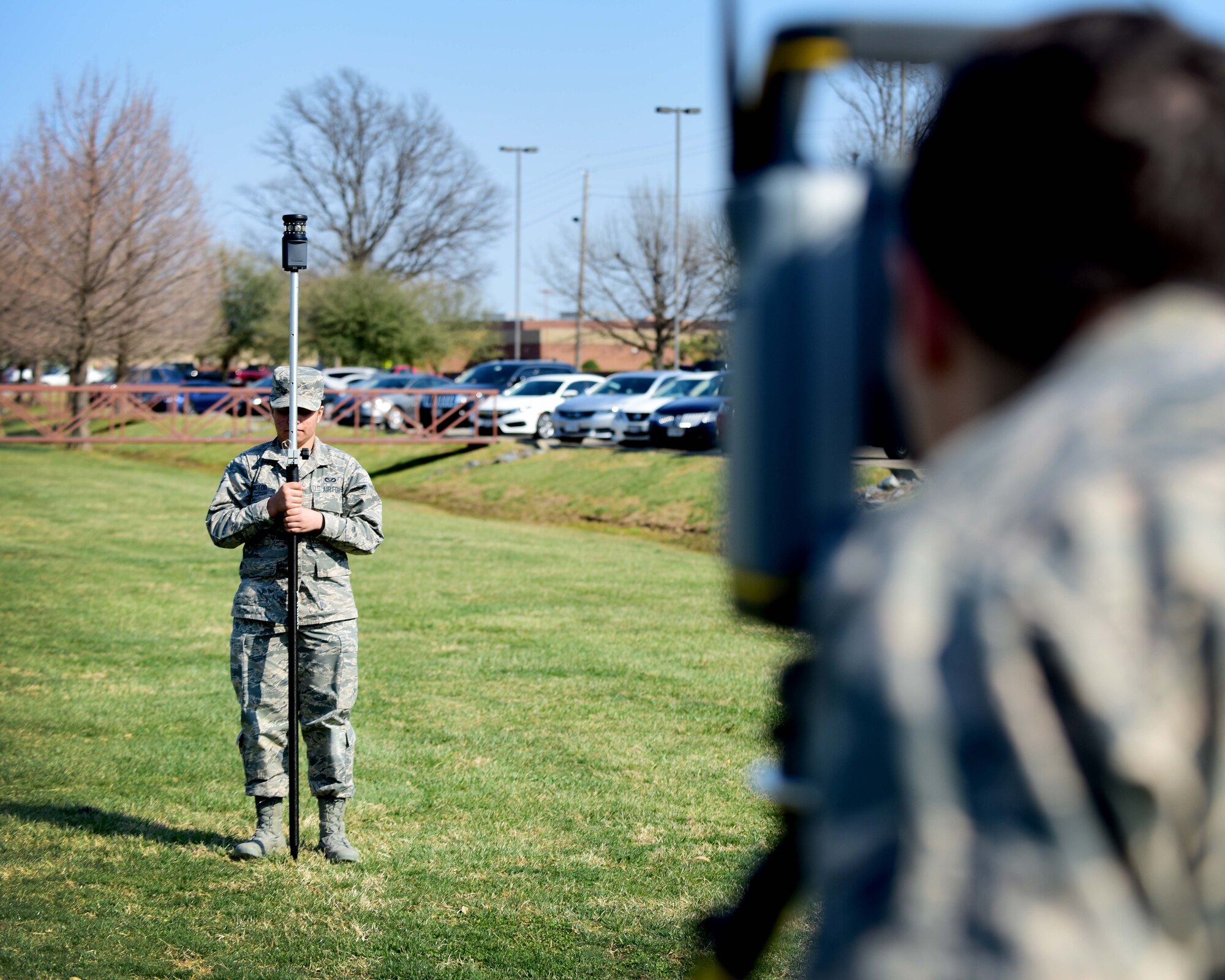 From left, U.S. Air Force Airman Gabrielle Victor and Airman 1st Class Ryan Mundt, 633rd Civil Engineer Squadron engineering technicians, prepare for an optical site survey, at Joint Base Langley-Eustis, Va., March 9, 2017. Victor and Mundt are members of the mapping section, which fulfills requests, such as finding appropriate locations for projects and estimating the resources needed for them. (U.S. Air Force photo/Senior Airman Areca T. Bell)