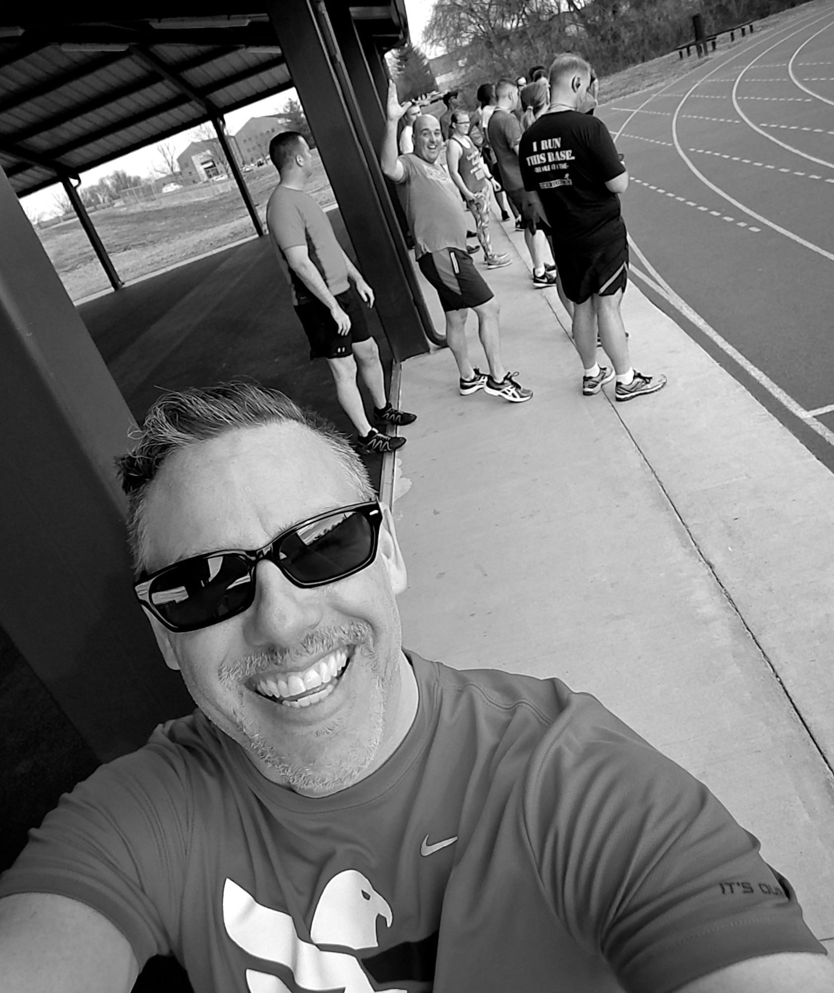 Christopher Parr, 932nd Airlift Wing Public Affairs specialist hams it up with fellow Group 1 members preparing to do sprints, on hated Wednesday, Feb. 22, 2017, Scott Air Force Base, Illinois. You can follow along with Parr's adventures in running by checking out his weekly blog in the commentaries section.  (U.S. Air Force photo by Christopher Parr)