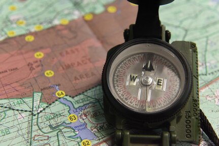 Airmen learned to read a map, use a compass and plot coordinates on the map using a protractor to execute land navigation during war skills training at McCrady Army National Guard Training Center, Eastover, South Carolina March 6, 2017. Airmen were required  to use land navigation to reach their destinations throughout the remainder of the training. Thirty members from Joint Base Charleston attended the weeklong war skills training that taught land navigation, combat casualty care, improvised explosive device identification procedures, hand-to-hand combat skills and team building exercises.