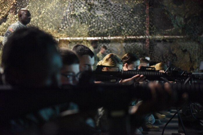 Airmen receive weapon familiarization in the Engagement Skills Trainer, a virtual training system. The EST provided fundamentals training and offered the opportunity to experience virtual scenarios at McCrady Army National Guard Training Center, Eastover, South Carolinar March 7, 2017. The EST saves countless dollars on ammunition annually and provides a safe, yet realistic, alternative to live rounds. Thirty Airmen from Joint Base Charleston attended the weeklong war skills training that taught land navigation, combat casualty care, improvised explosive device identification procedures, hand-to-hand combat skills and team building exercises.