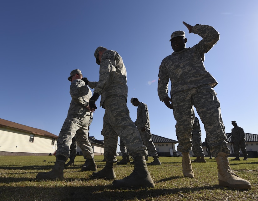 Joint Base Charleston Airmen rehearse detention procedures as a part of base operations training at McCrady National Guard Training Center March 9, 2017. The Airmen learned a variety of apprehension and search techniques and the scenarios in which to use each. Thirty Airmen from Joint Base Charleston attended the weeklong war skills training that taught land navigation, combat casualty care, improvised explosive device identification procedures, hand-to-hand combat skills and team building exercises.